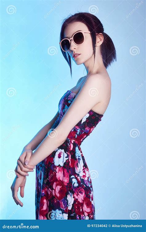 woman floral dress sunglasses